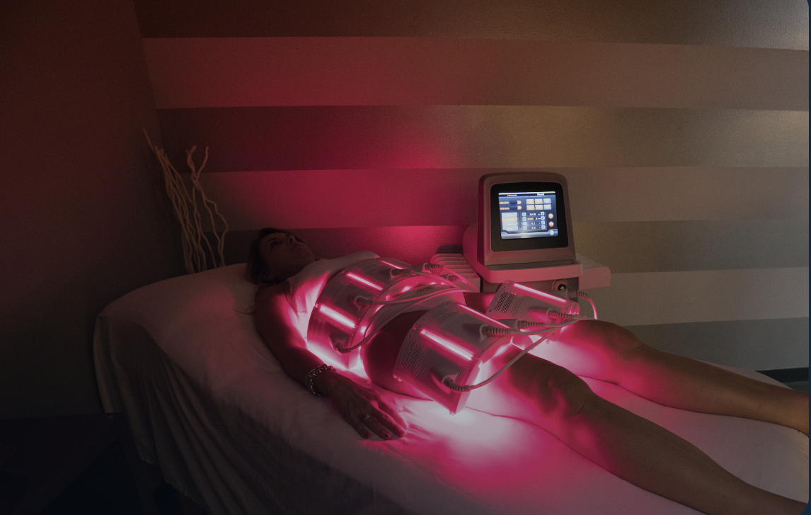 Client receiving a PBM Body Pro red light session